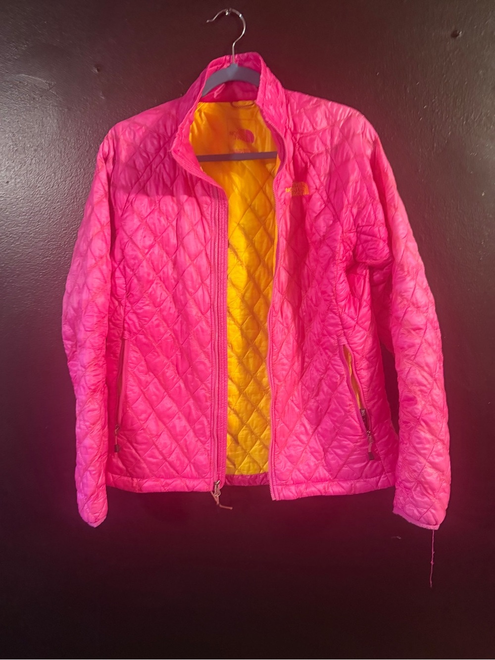 The North Face Women's Bright Pink Quilted Puffer Jacket with Yellow Lining